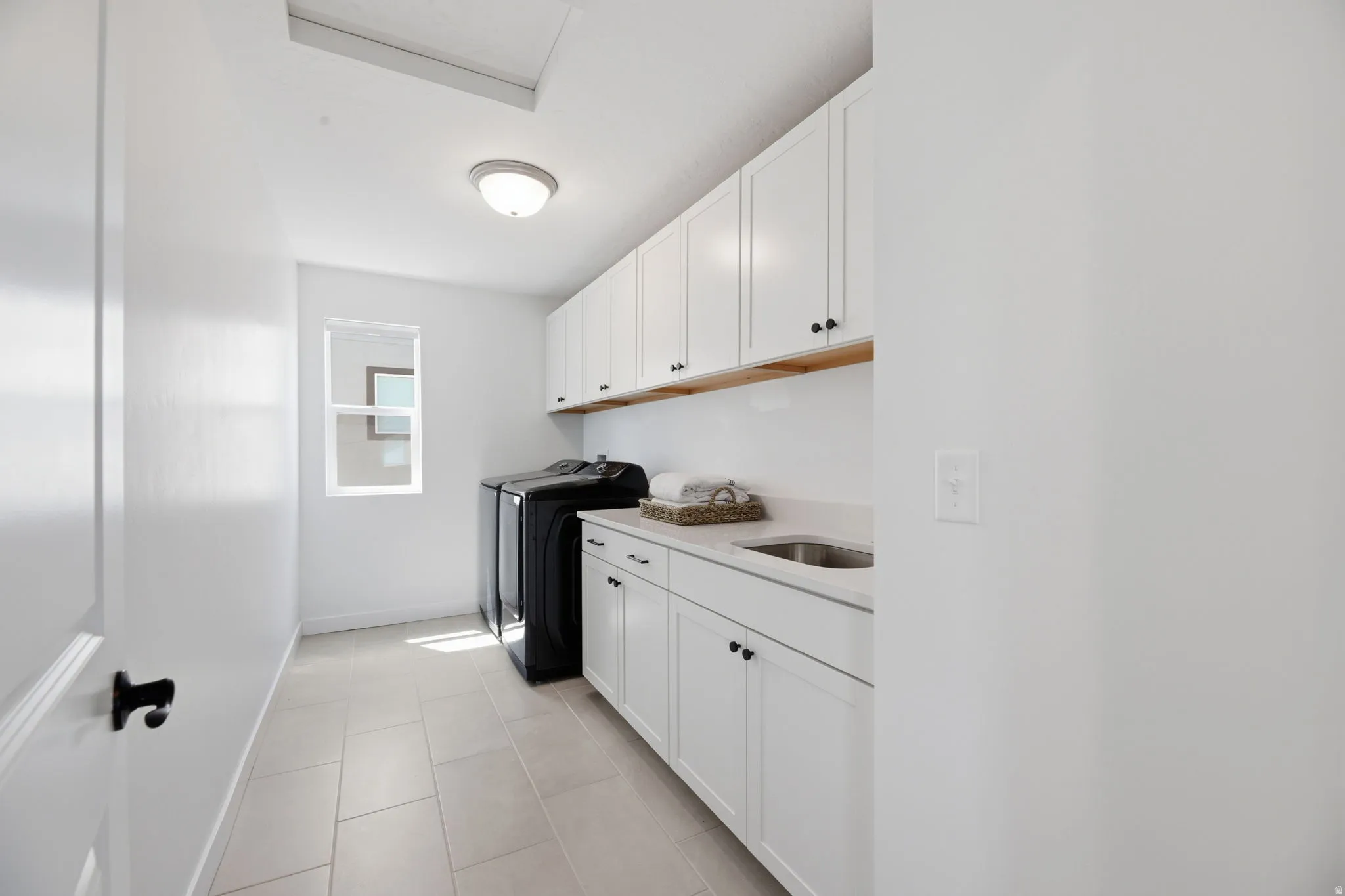 Spacious Laundry w/Lots of Cabinets for Storage & Sink!