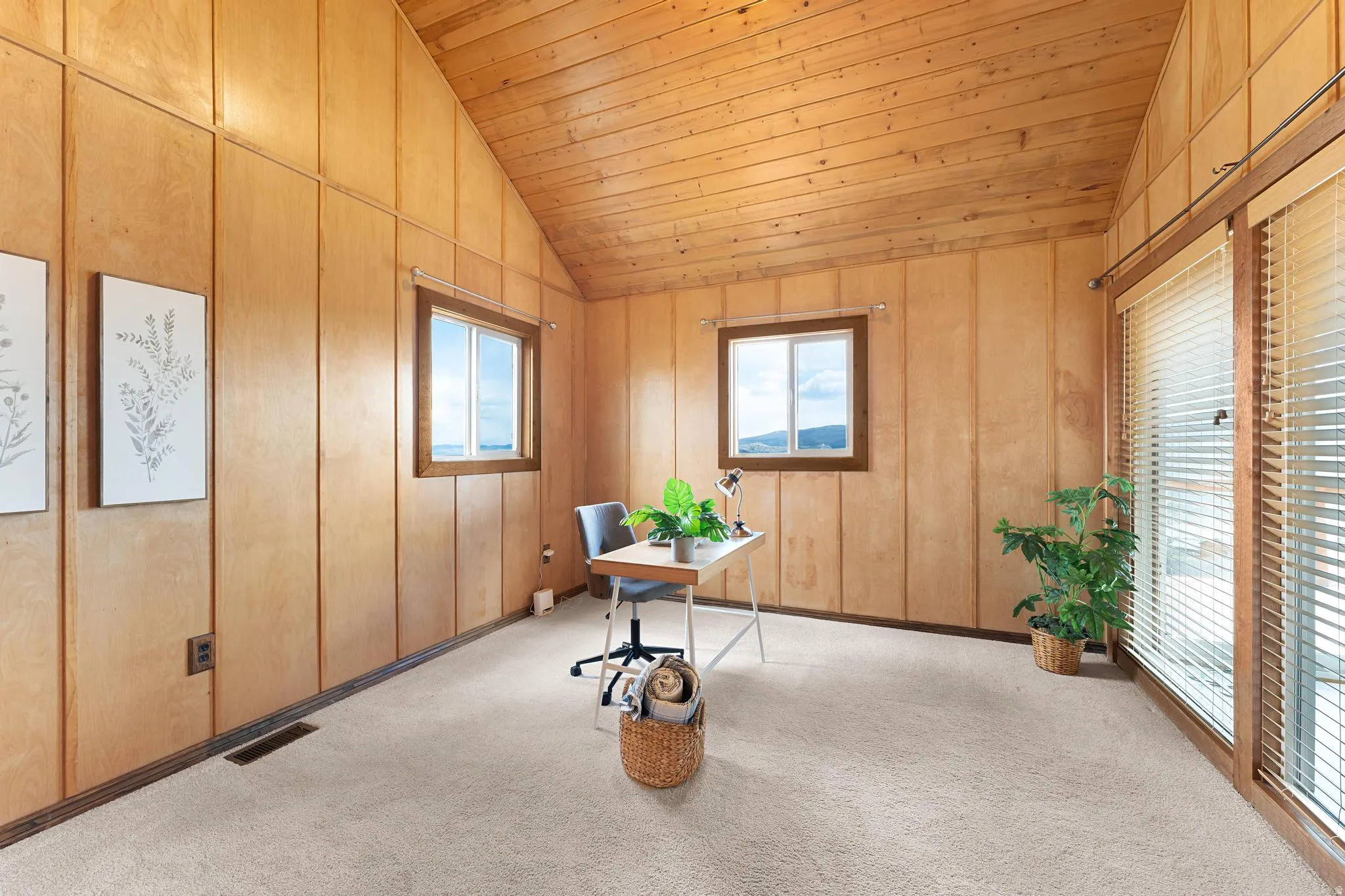Unfurnished office with light carpet and a vaulted wood ceiling