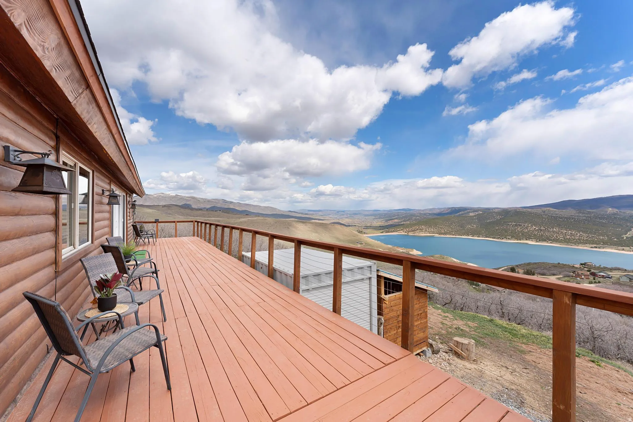 Deck featuring a water and mountain view