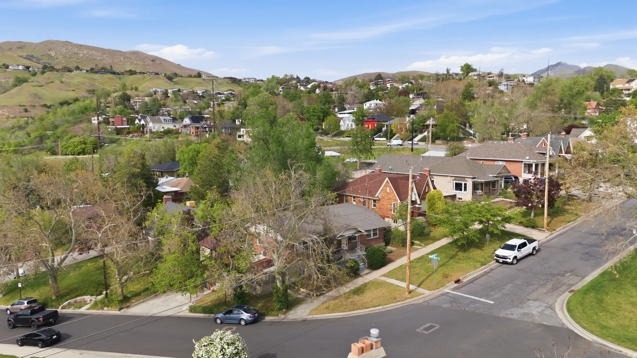 Aerial perspective of suburban area with a mountainous background