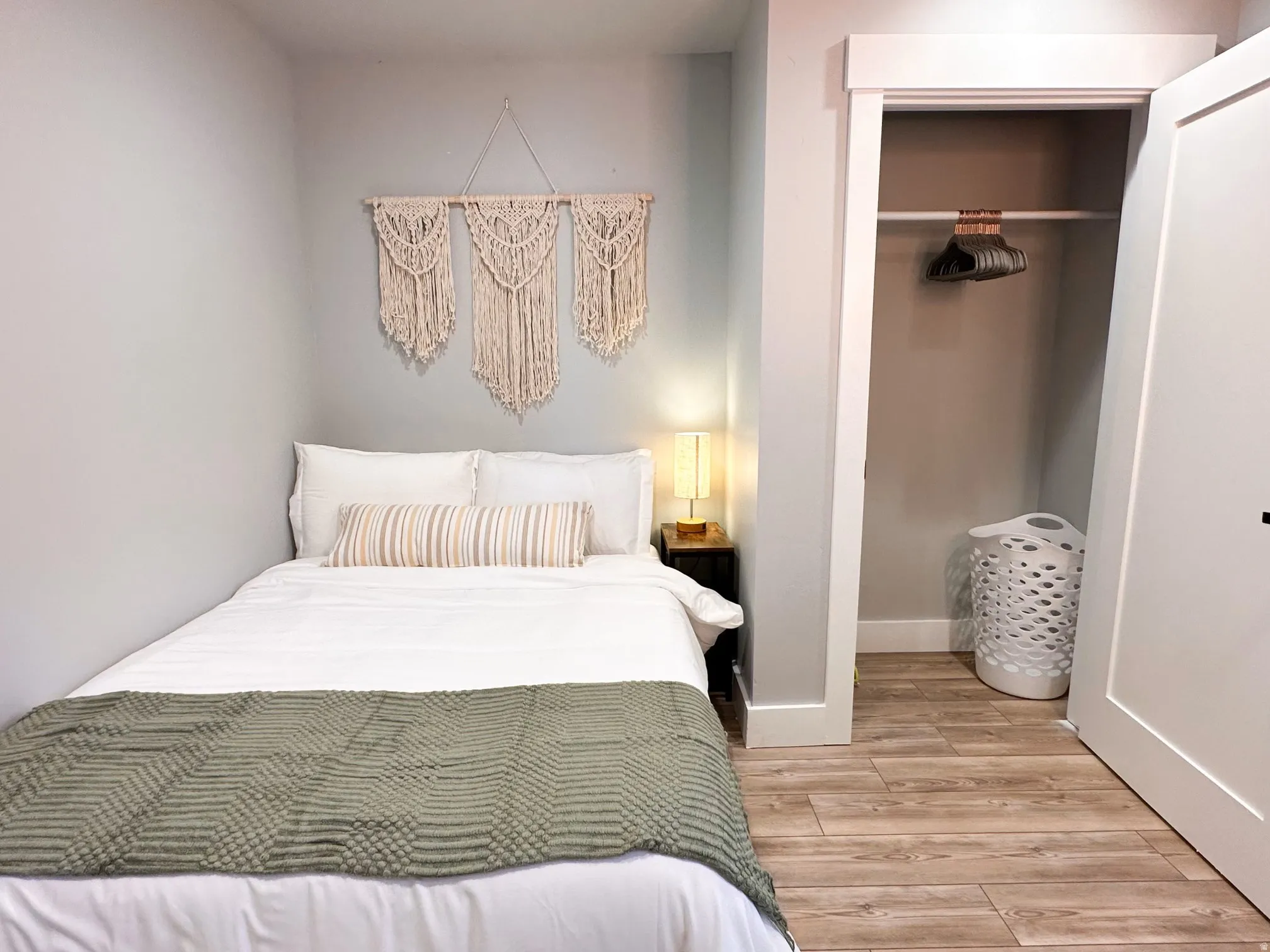Furnished Unit #44 Bedroom featuring a closet and light wood-type flooring