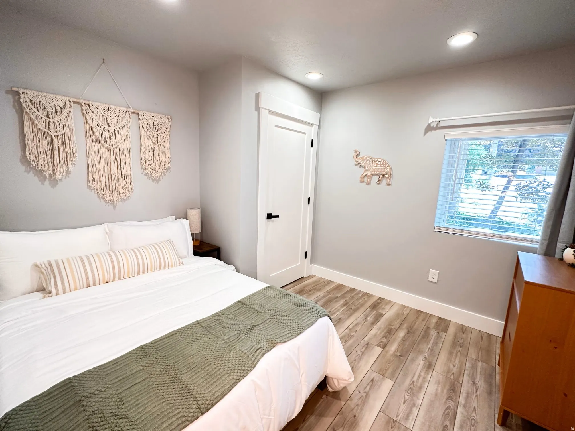 Furnished Unit #44 Bedroom featuring light wood-style floors and recessed lighting