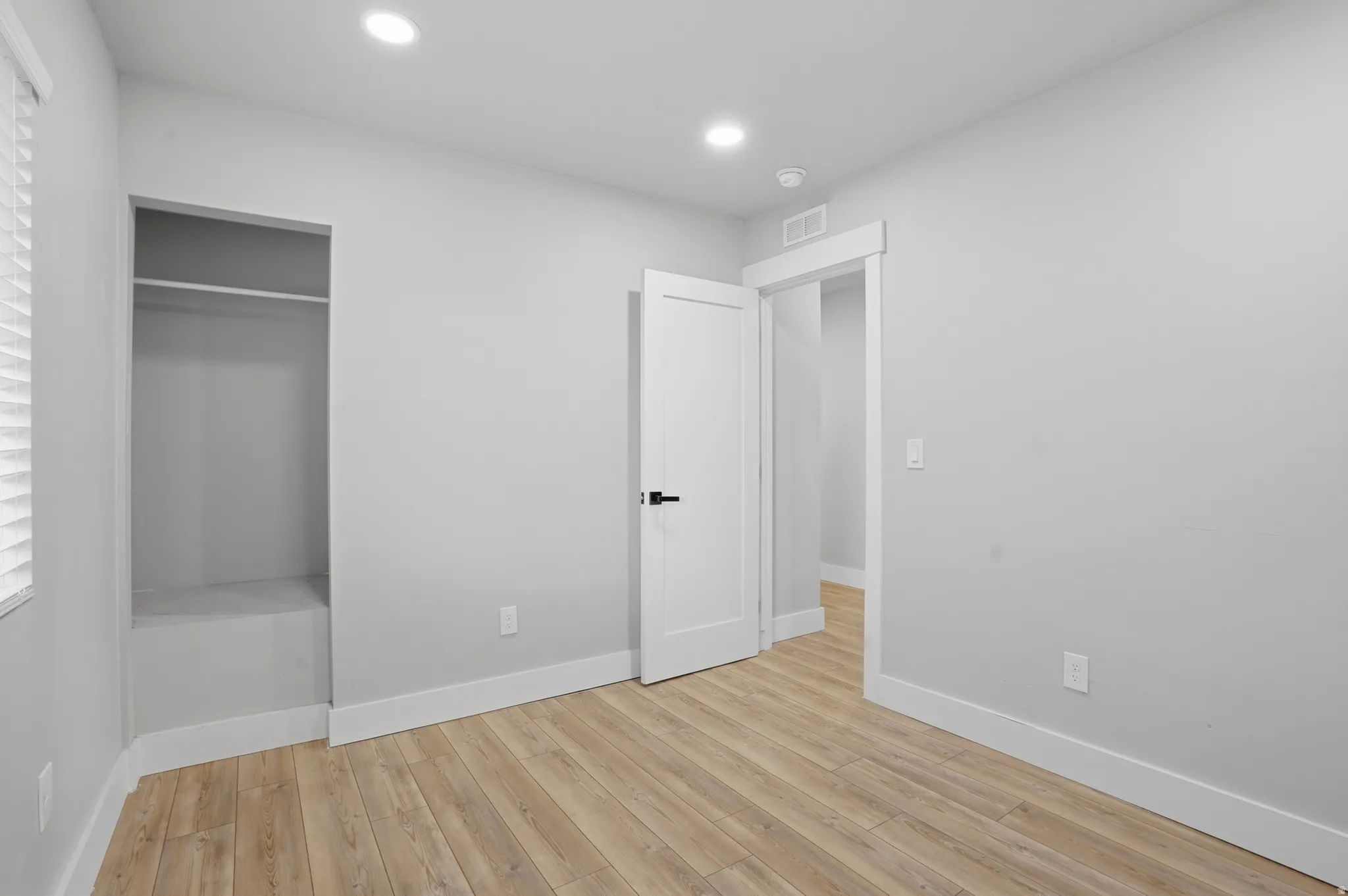 Unit #40 Unfurnished bedroom featuring light wood-style floors, a closet, and recessed lighting