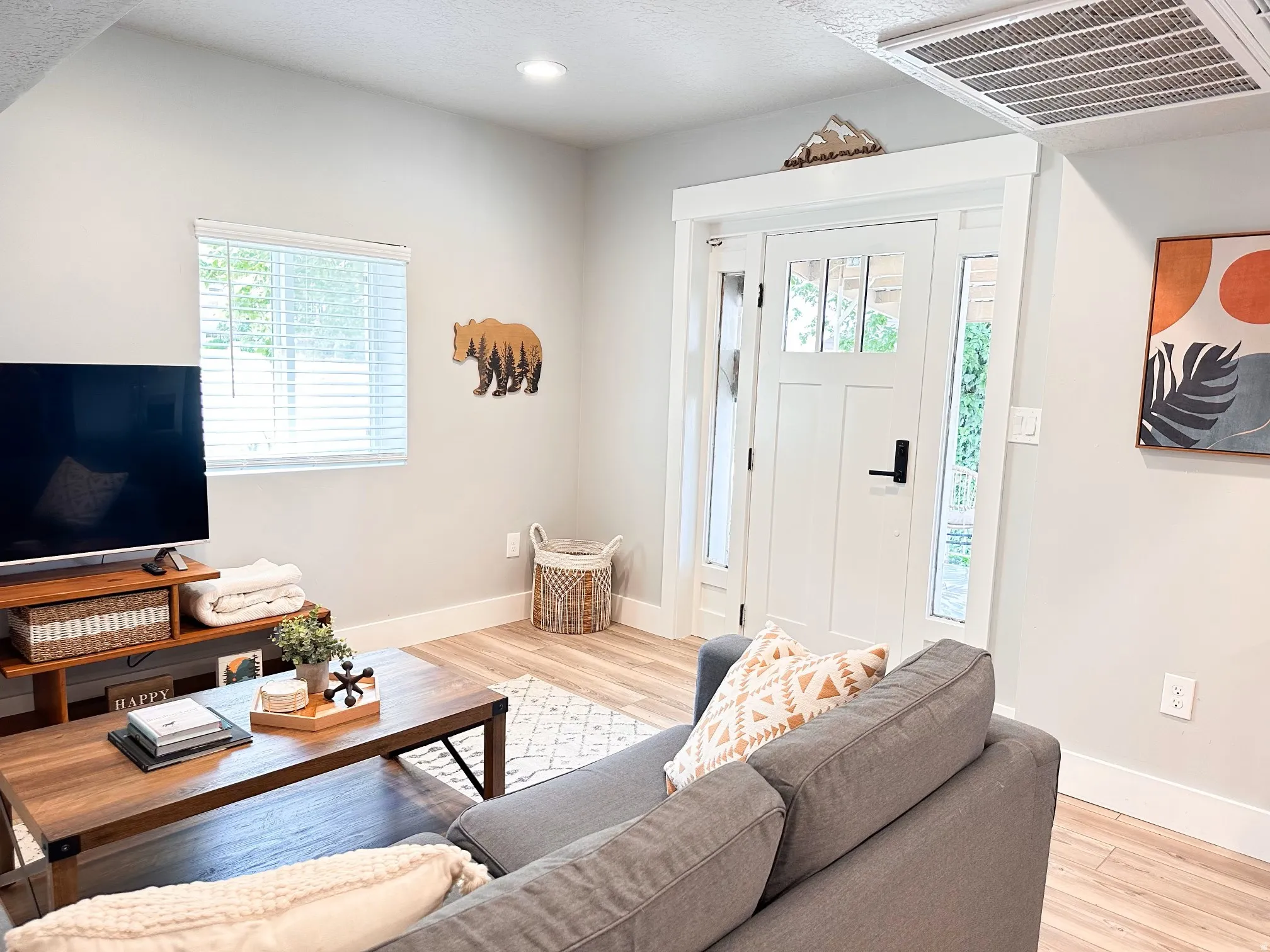 Furnished Unit #44 Living room with healthy amount of natural light, light wood-type flooring, recessed lighting, and a textured ceiling