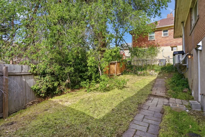 View of fenced backyard