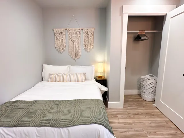 Furnished Unit #44 Bedroom featuring a closet and light wood-type flooring