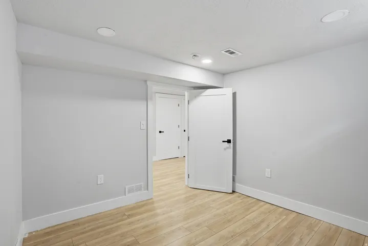 Unit #40 studio apartment with separate entrance. Unfurnished room with light wood finished floors and recessed lighting