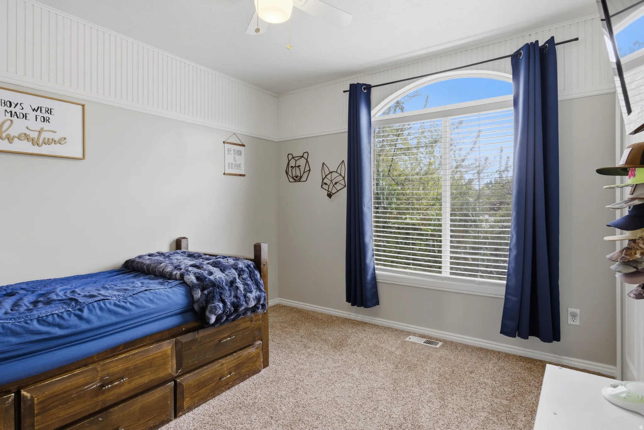 Bedroom featuring light carpet and a ceiling fan