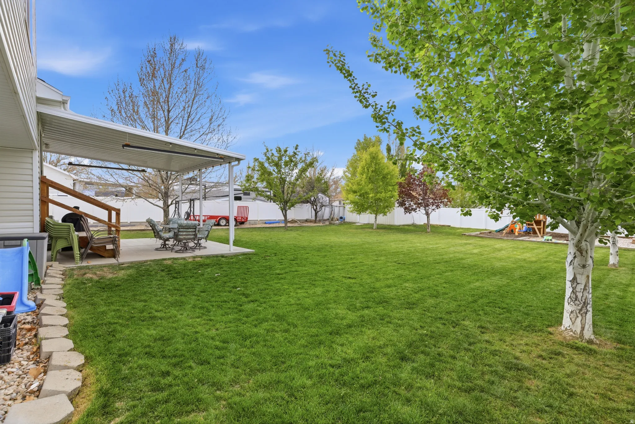 Fenced backyard featuring a patio area