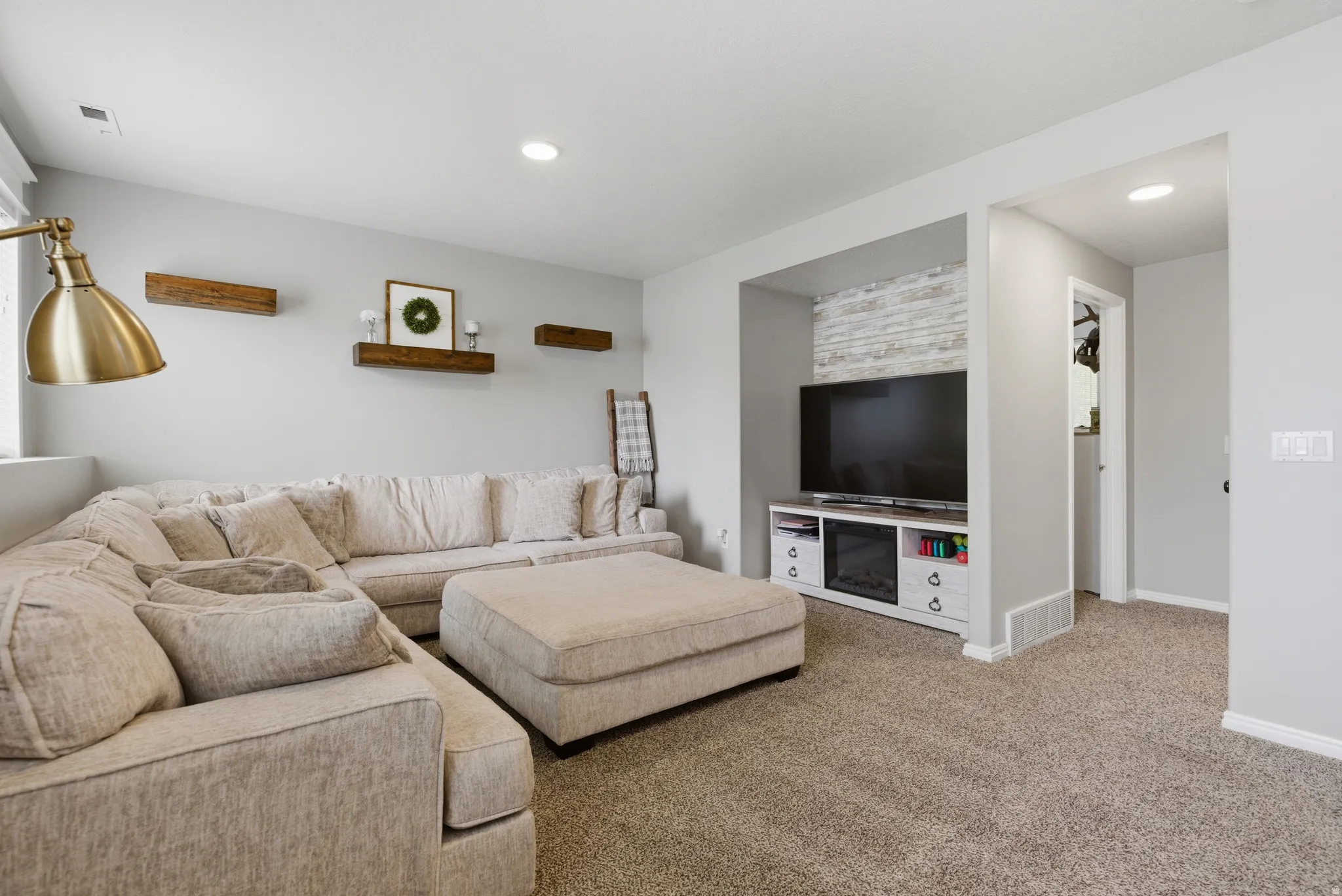 Living room with carpet and recessed lighting