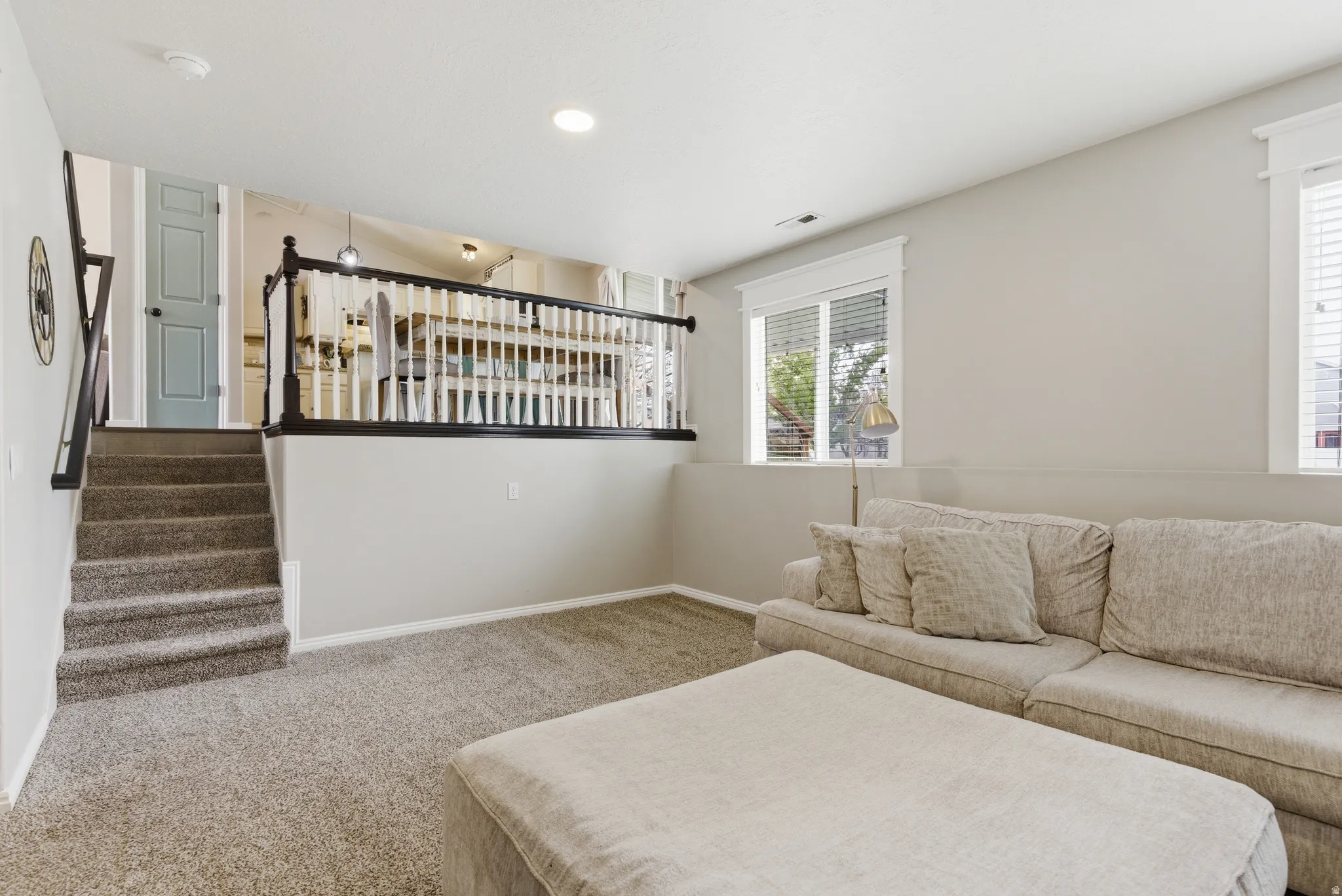 Carpeted bedroom with recessed lighting and baseboards
