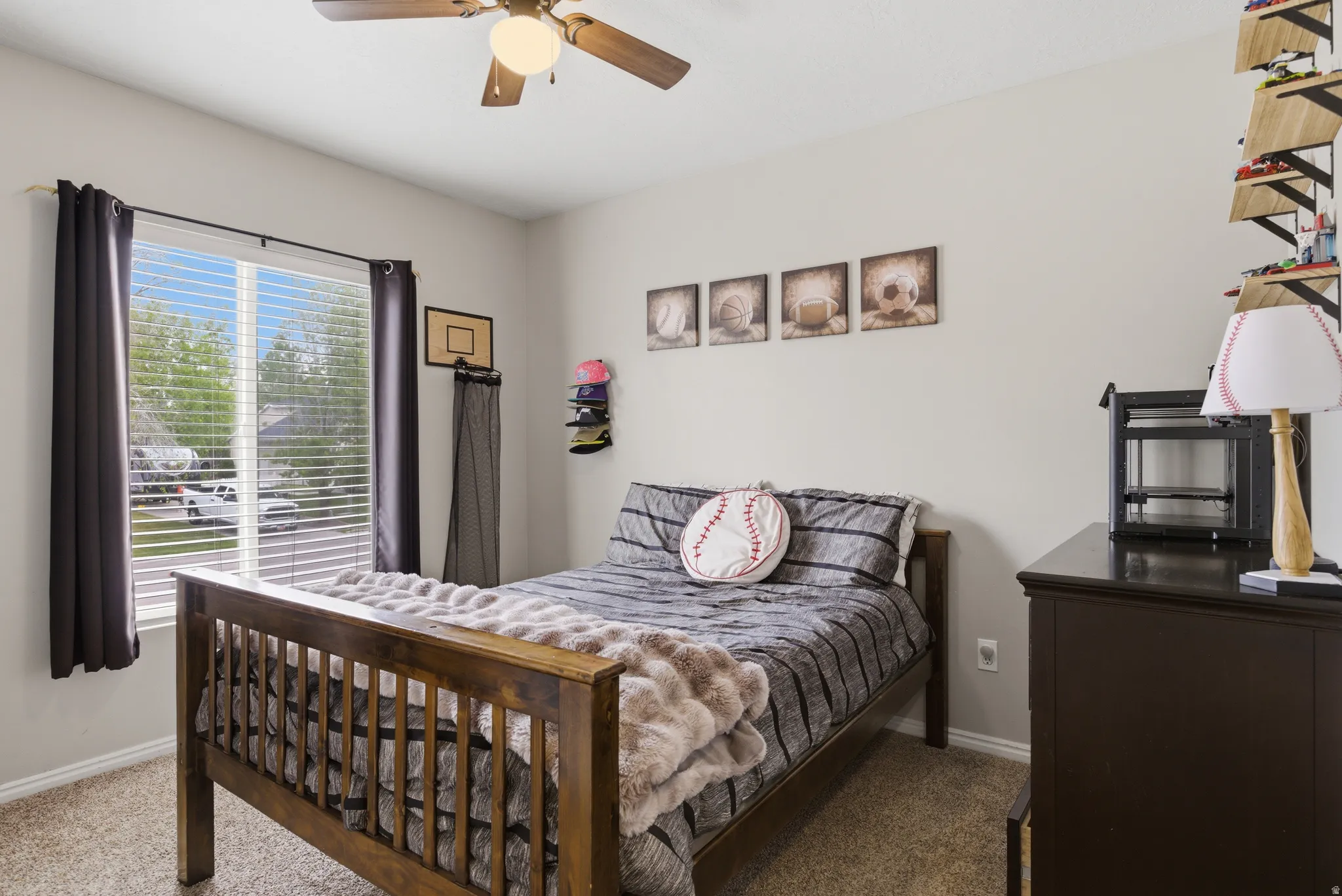 Bedroom with a ceiling fan and carpet floors