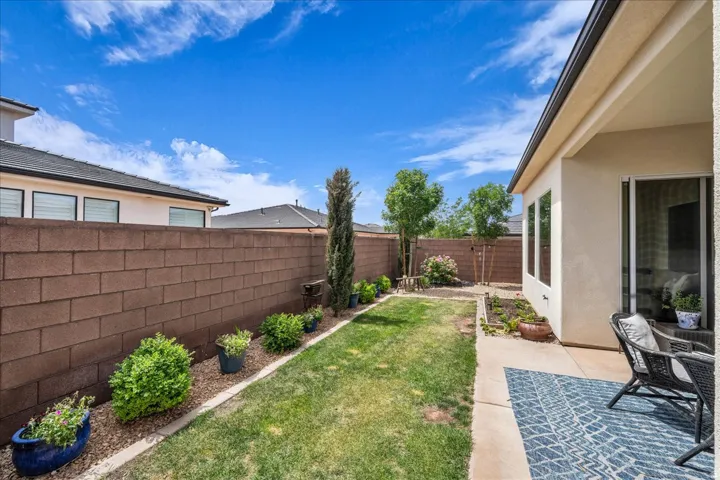 Fenced backyard featuring a patio