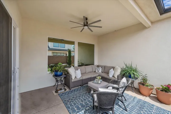 View of patio / terrace with ceiling fan and an outdoor lounge area