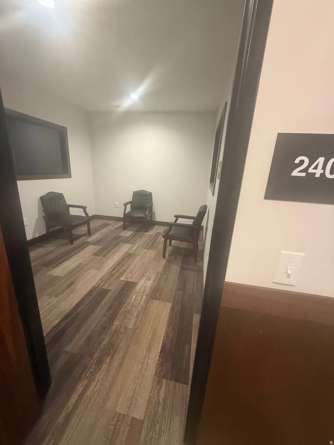 Living area with dark wood-style floors