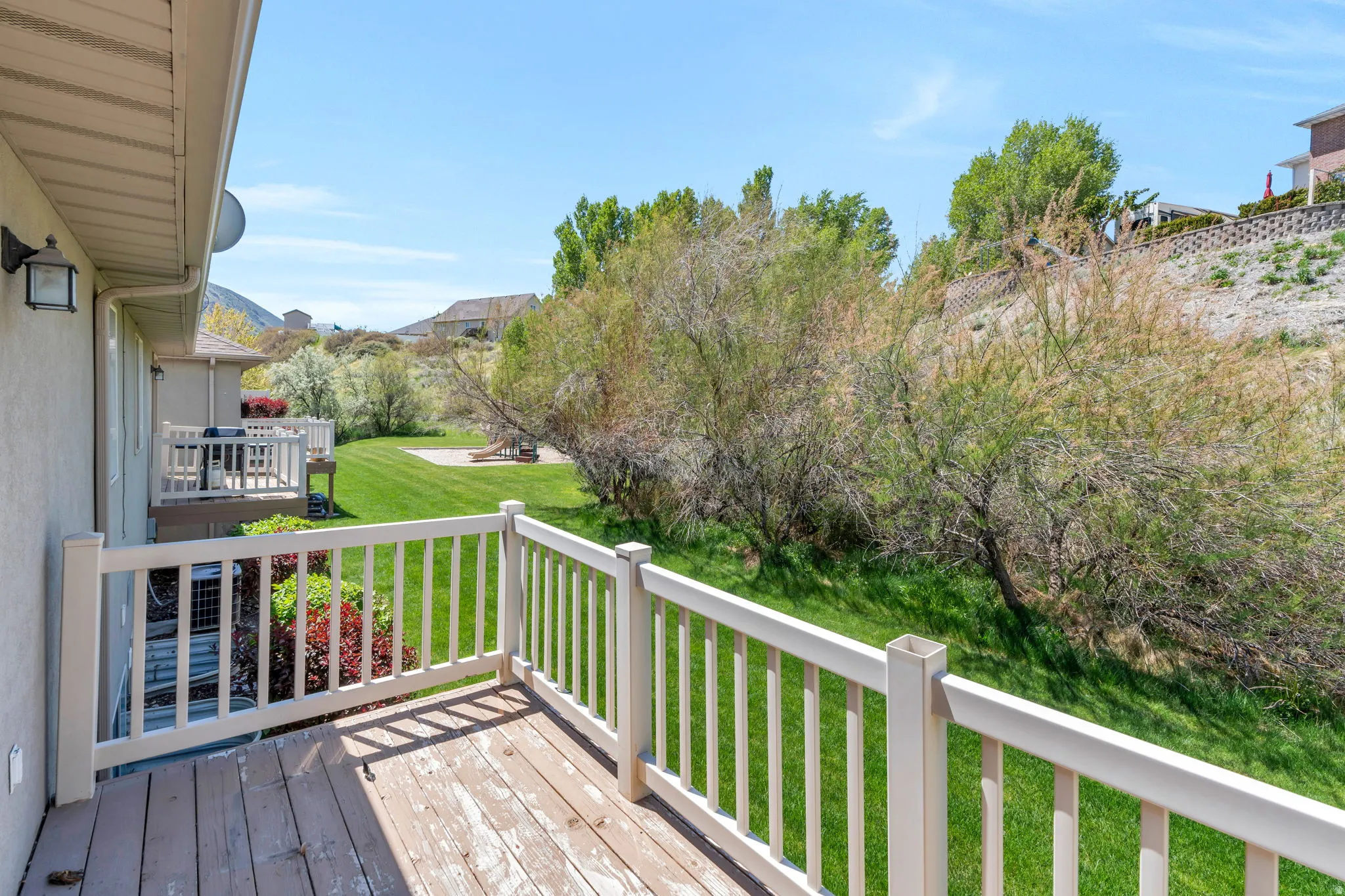 Wooden deck featuring a yard