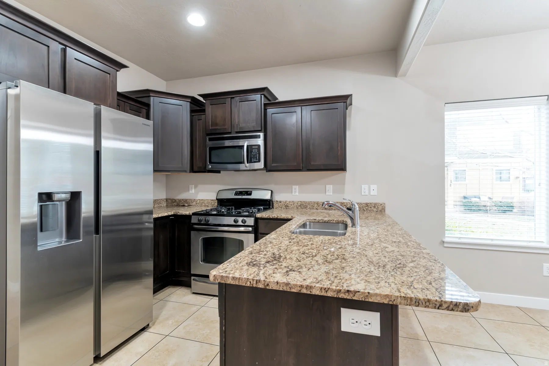 Kirchen with Stainless Steel Appliances and Granite Counter Tops