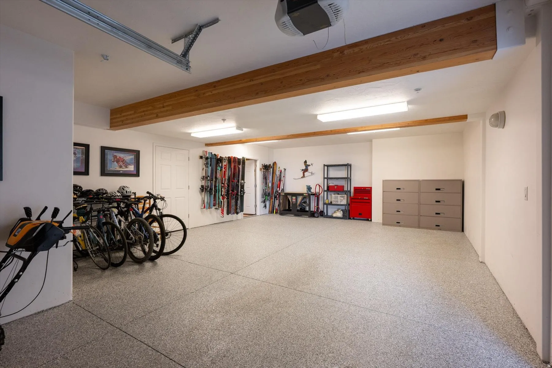 Garage featuring a garage door opener