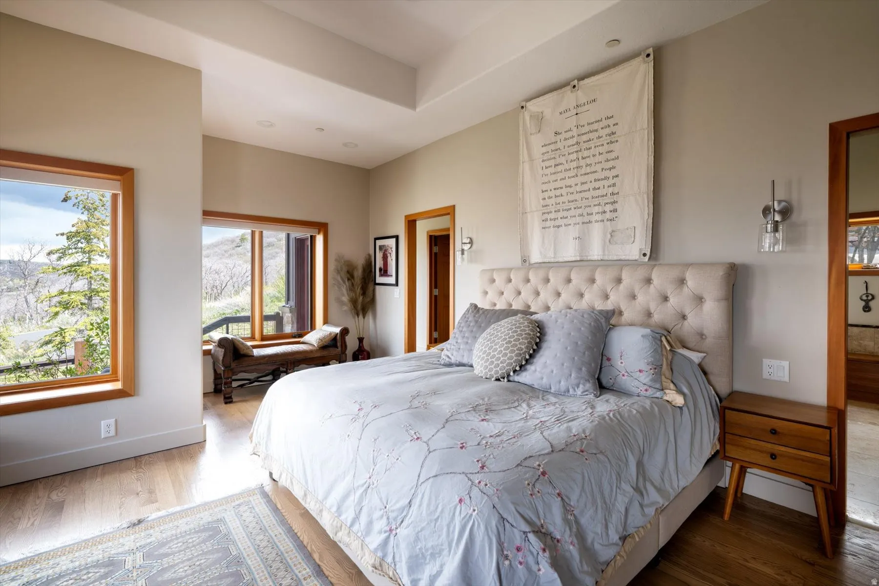 Bedroom featuring wood finished floors and baseboards