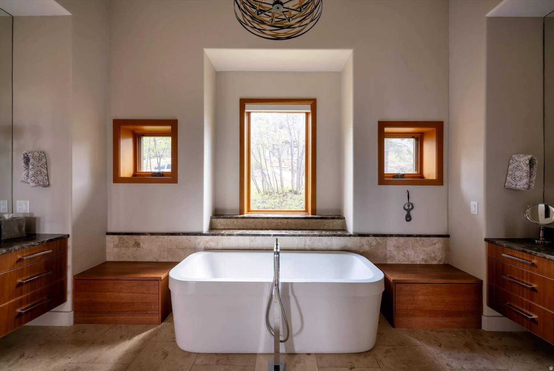 Full bath with vanity and a freestanding tub