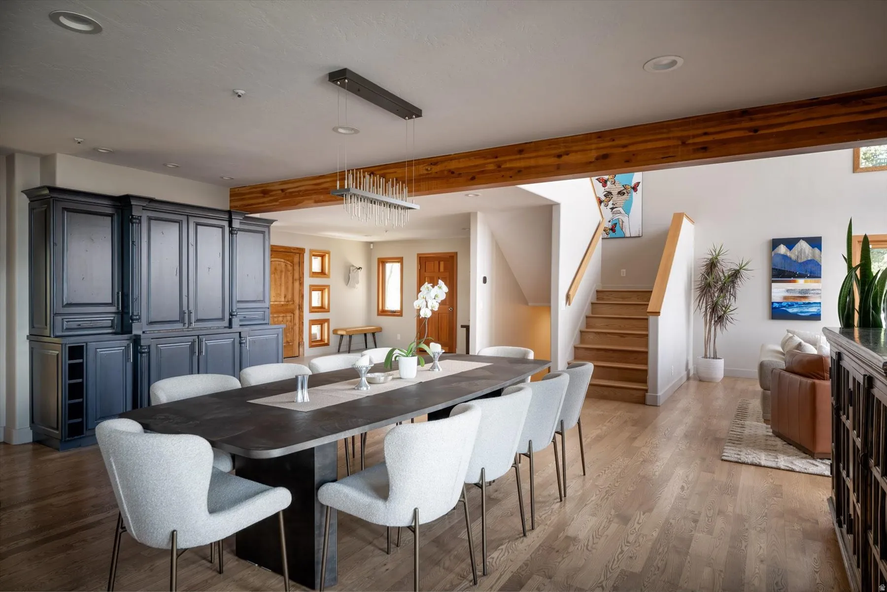 Dining area with light wood-style flooring and recessed lighting
