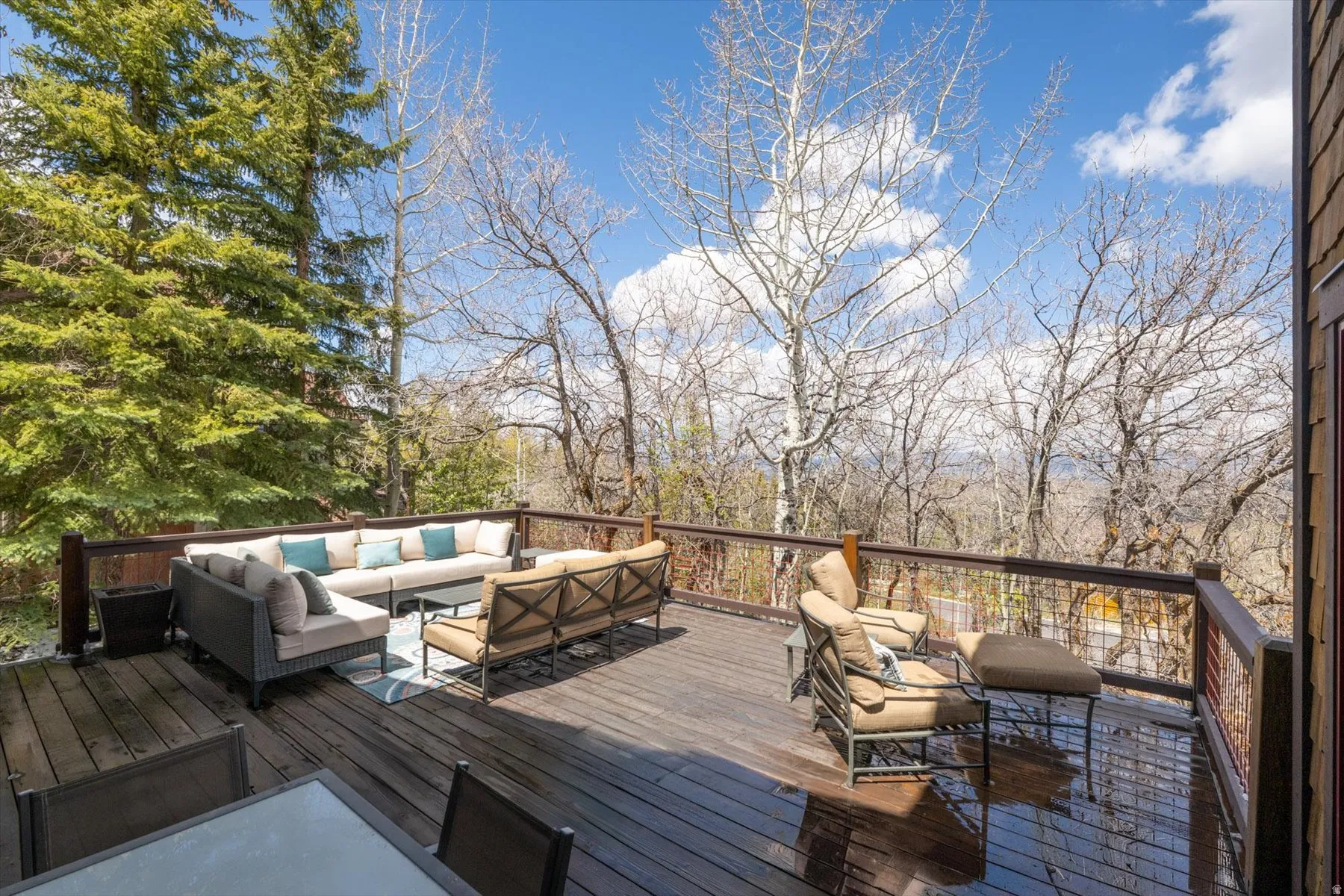 Wooden terrace with an outdoor lounge area