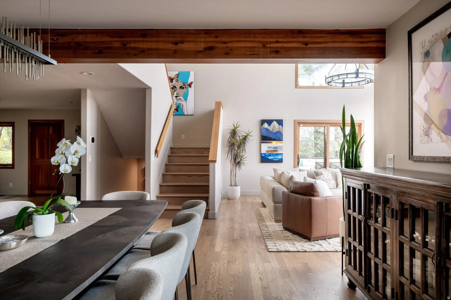 Dining space featuring stairway and wood finished floors