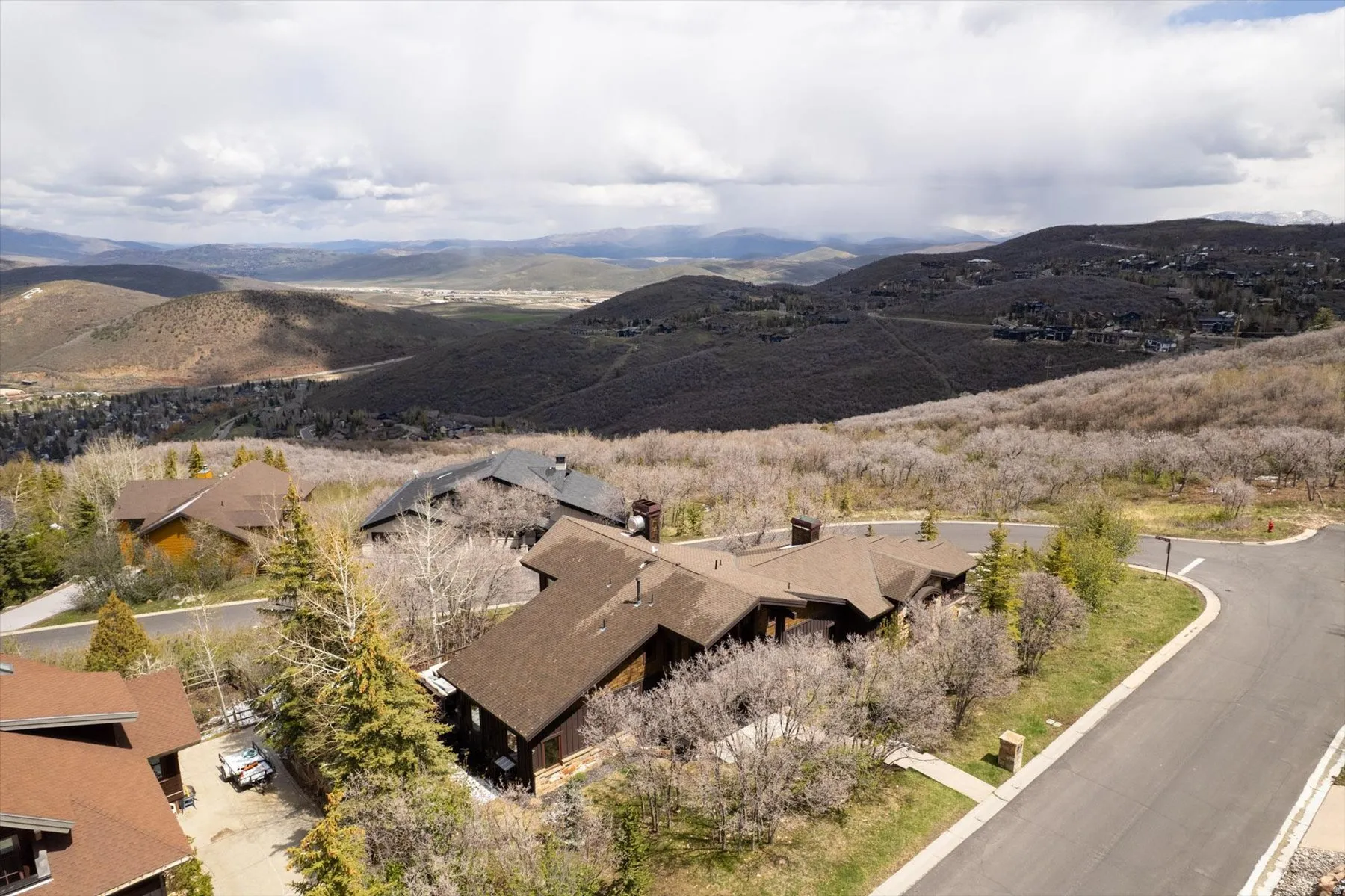 View of mountain backdrop featuring nearby suburban area