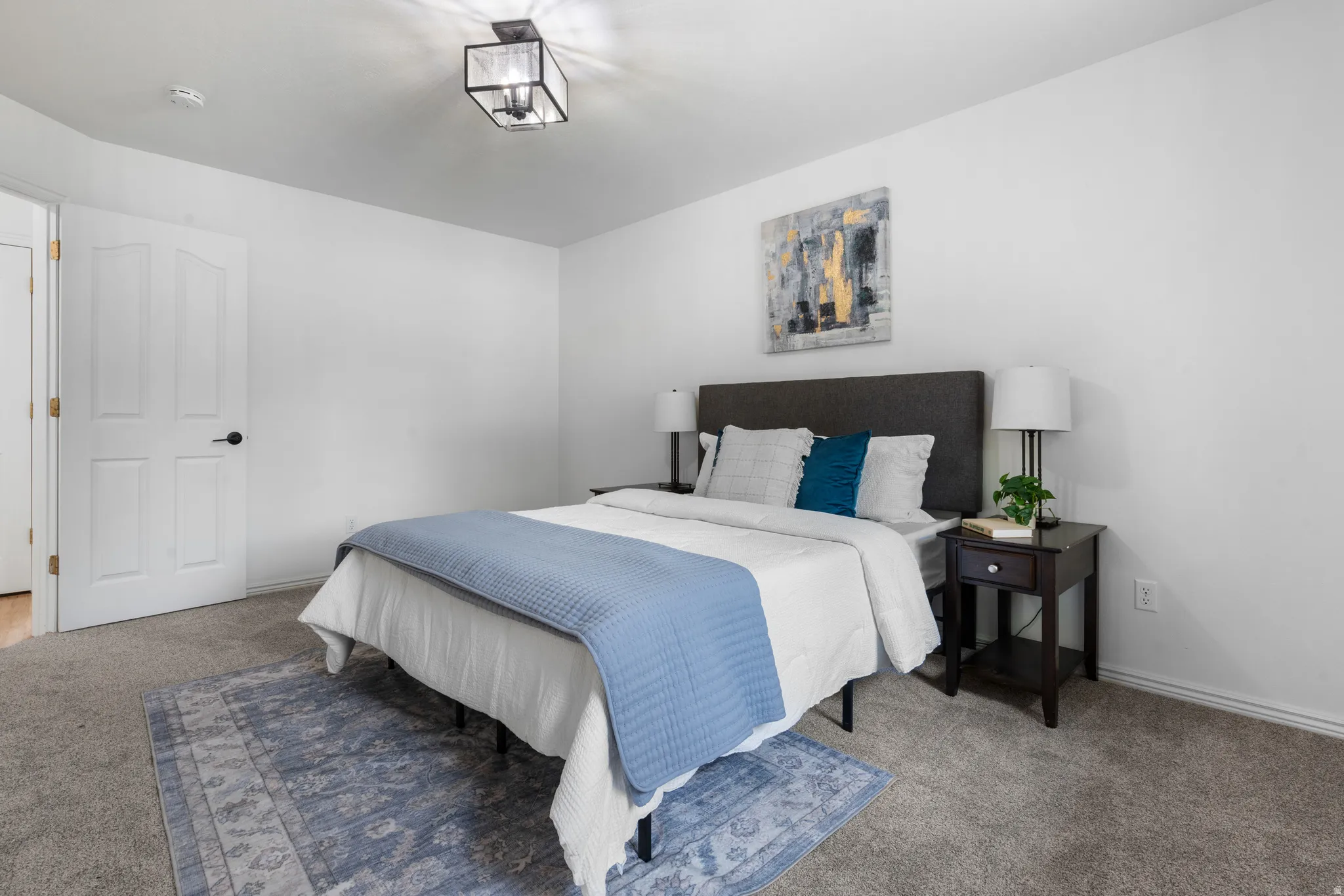 Carpeted bedroom featuring baseboards