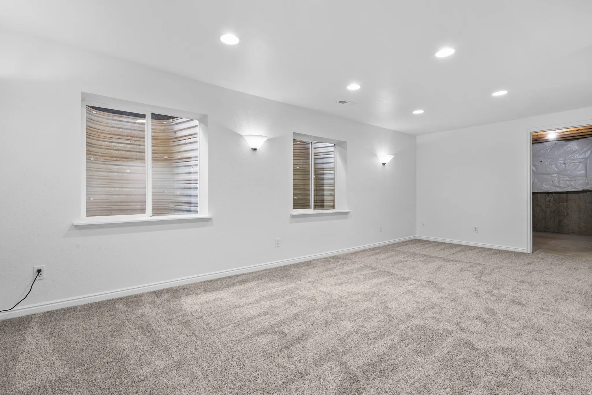 Spare room featuring carpet floors and recessed lighting