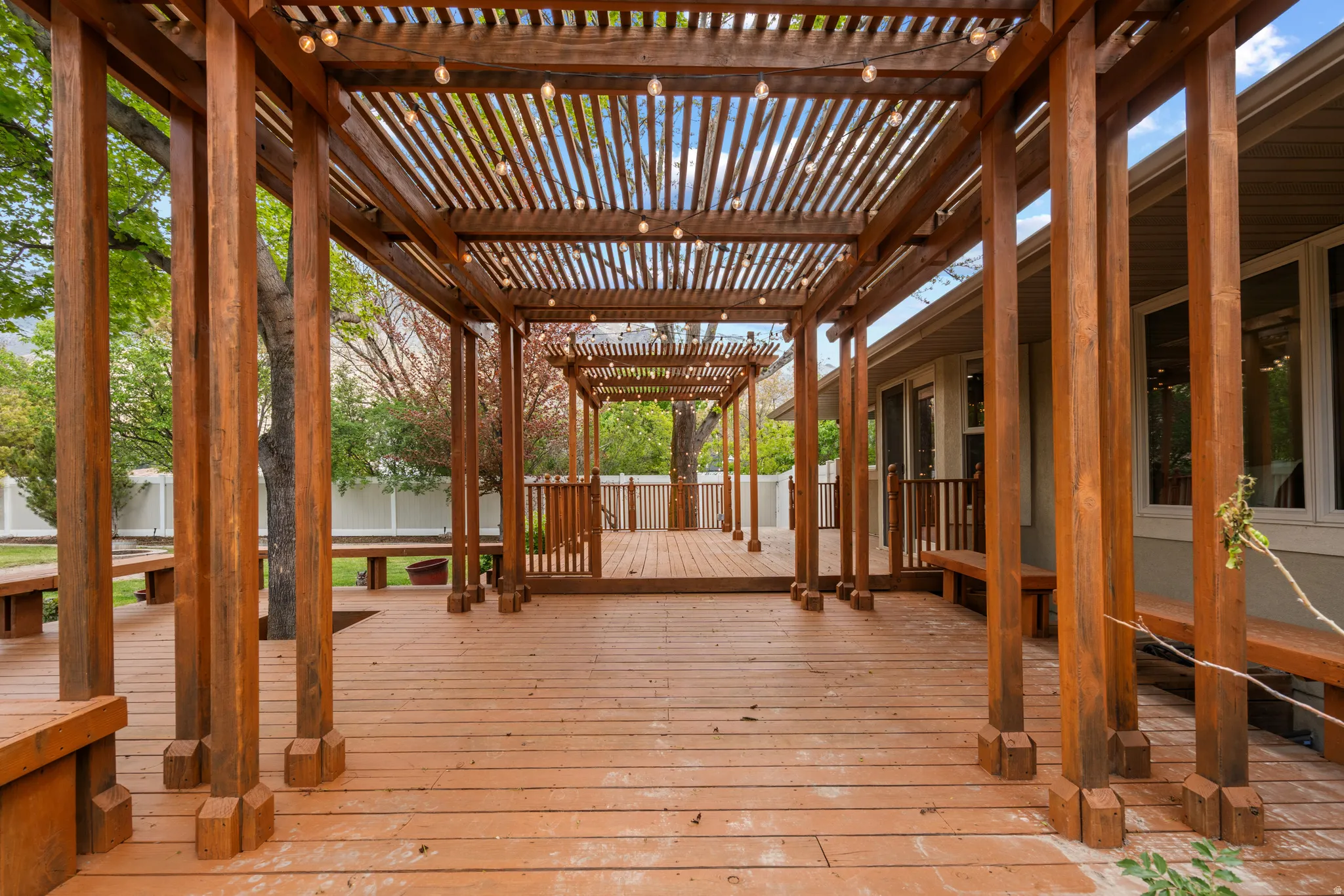 Deck featuring a pergola