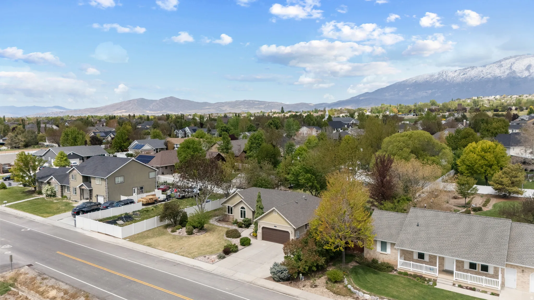 Aerial perspective of suburban area with a mountainous background