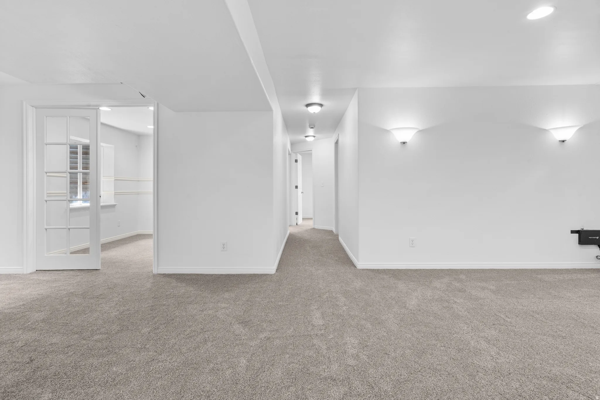 Unfurnished room featuring light carpet and recessed lighting