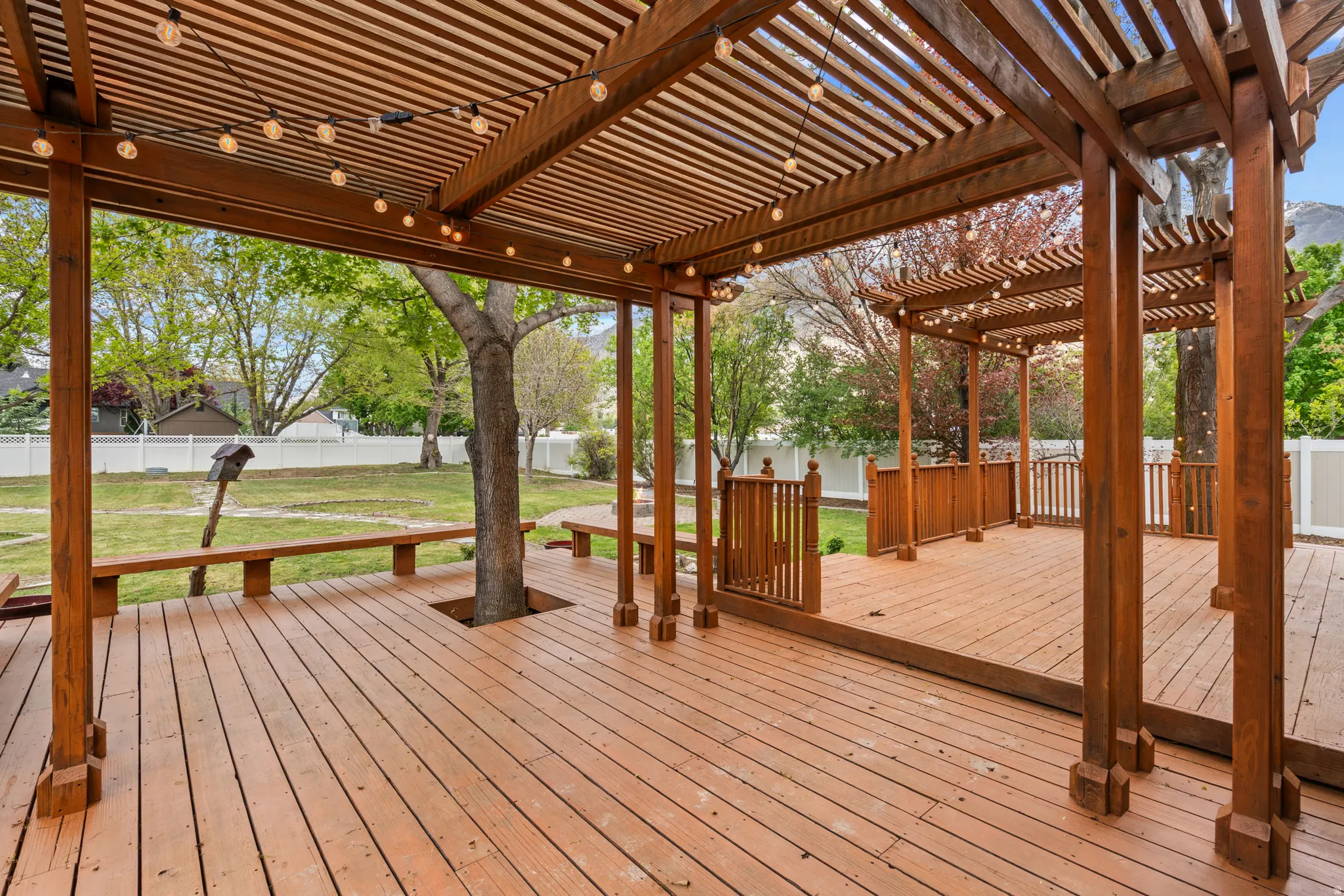 Wooden terrace featuring a fenced backyard