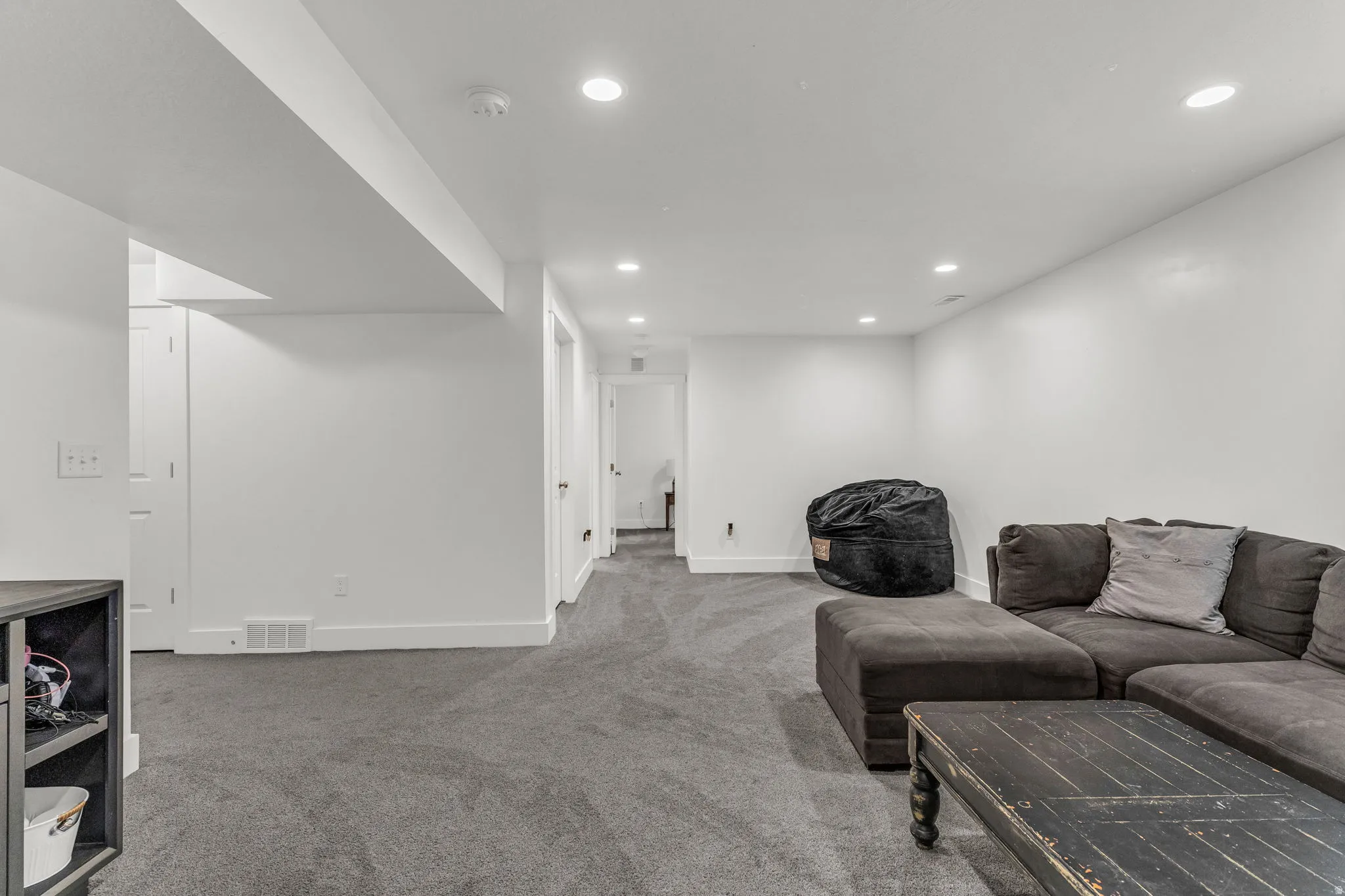 Living area featuring recessed lighting and carpet flooring