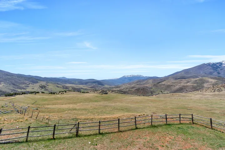 View of mountain background featuring rural landscape