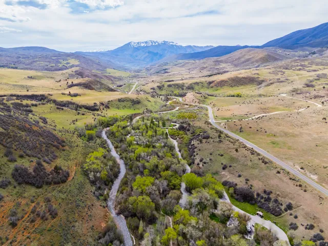 Aerial view of sparsely populated area featuring a mountainous background
