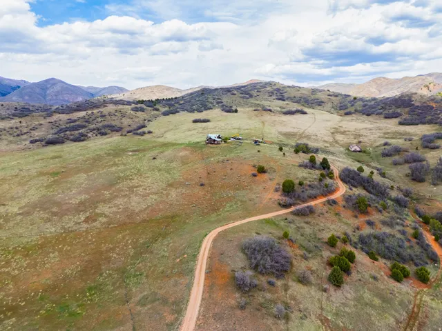 Aerial view of sparsely populated area with a mountainous background
