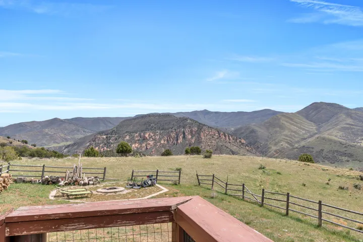 View of mountain backdrop with rural landscape
