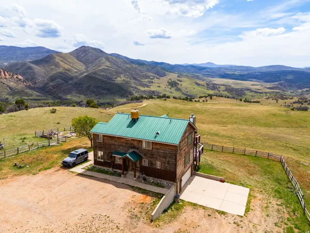 Aerial view of sparsely populated area with a mountain backdrop