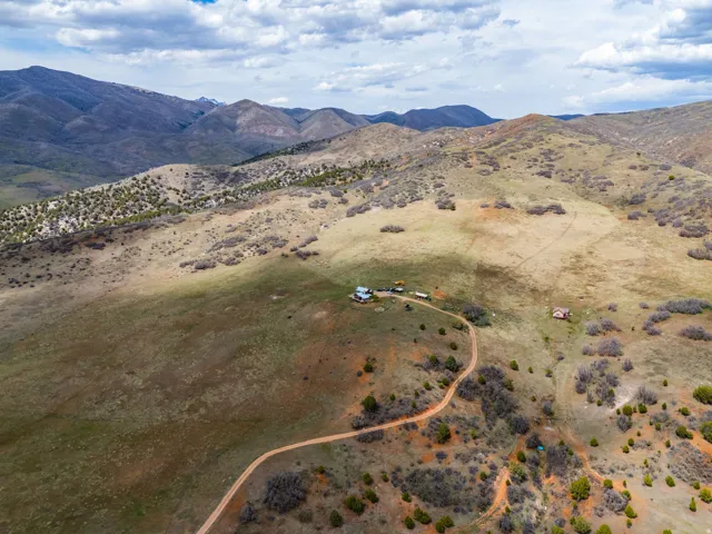 Aerial view of sparsely populated area with a mountainous background