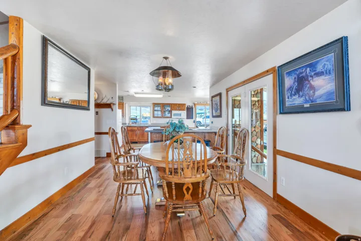 Dining room featuring light wood-style flooring and hanging lights