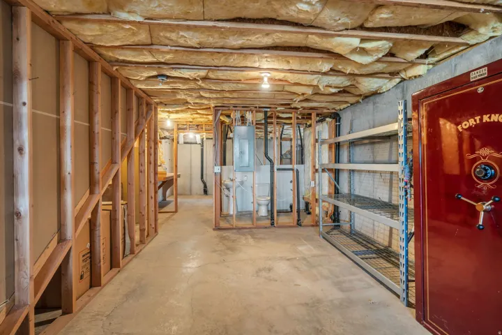Unfinished below grade area with electric panel