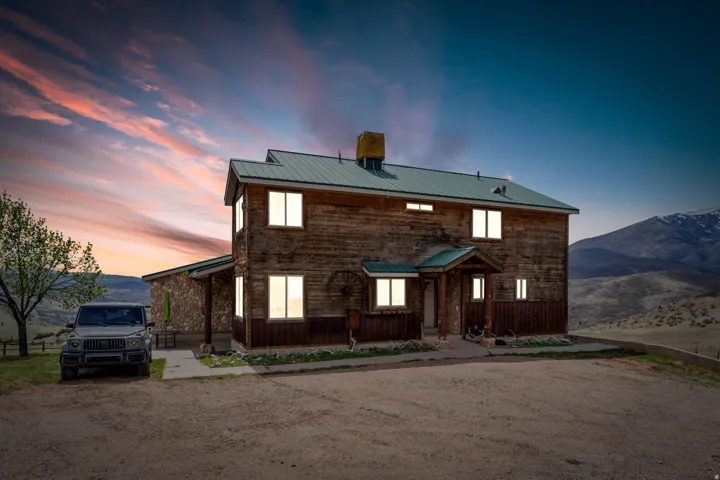 View of front of home featuring a metal roof and a mountain view