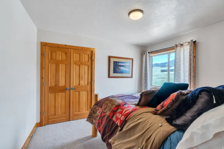 Carpeted bedroom with baseboards