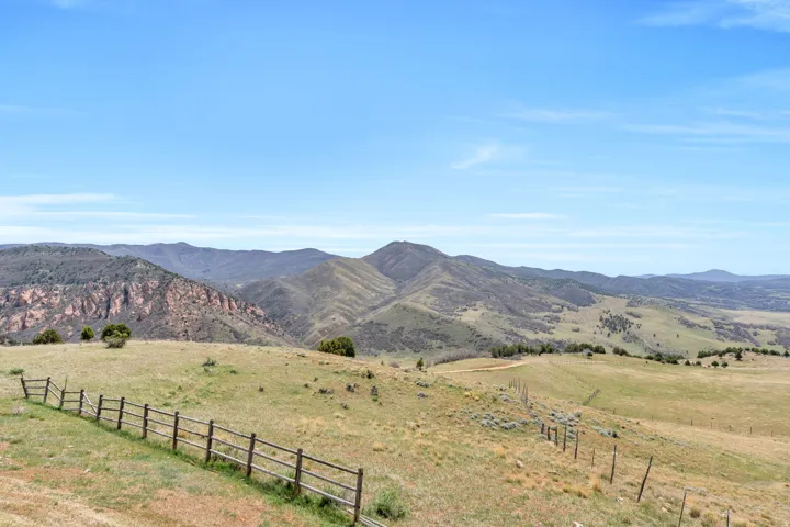 View of mountain background featuring rural landscape