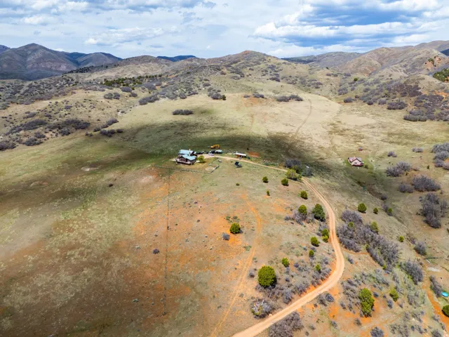 Aerial view of sparsely populated area featuring a mountainous background