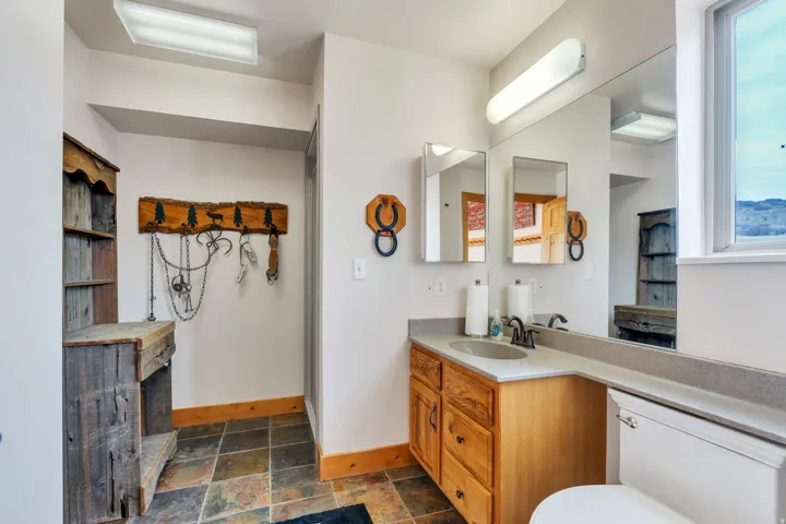 Bathroom featuring vanity and stone tile flooring