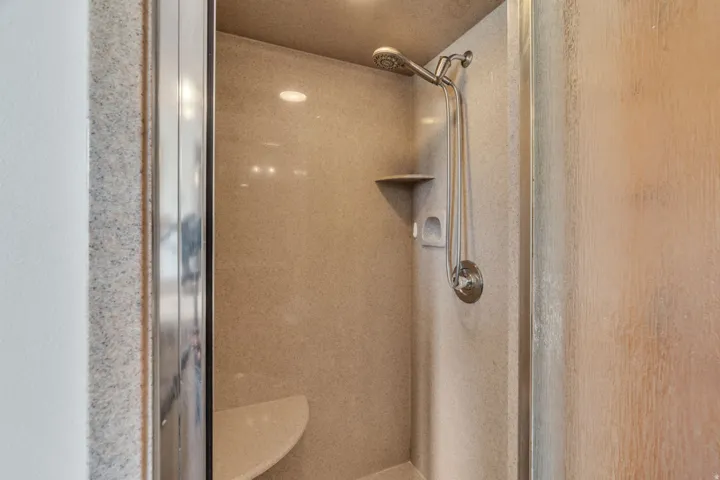 Full bathroom featuring a stall shower