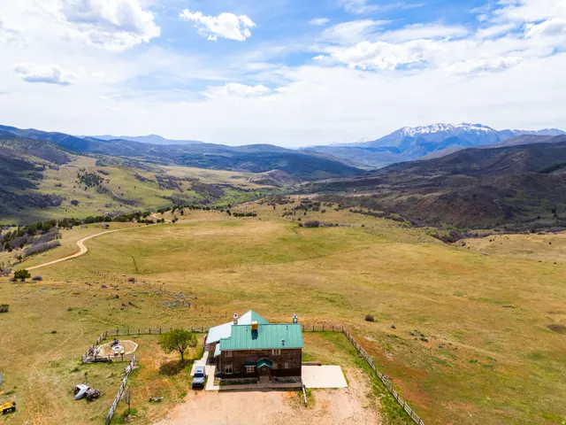 Aerial view of sparsely populated area featuring a mountainous background